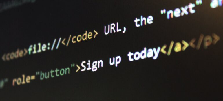 Lines of code across a black screen.