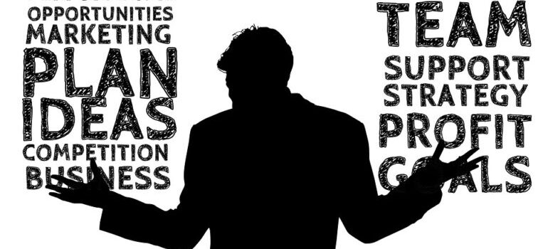 A sketch of a person's outline in front of business-related terms.