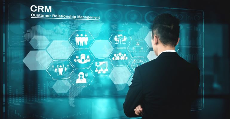 Persona looking at hologram with different CRM processes that boost sales efficiency.