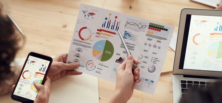 Two people checking data.