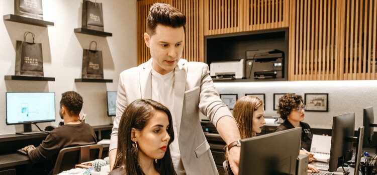 A professional team making a plan in order to overcome barriers to CRM success.