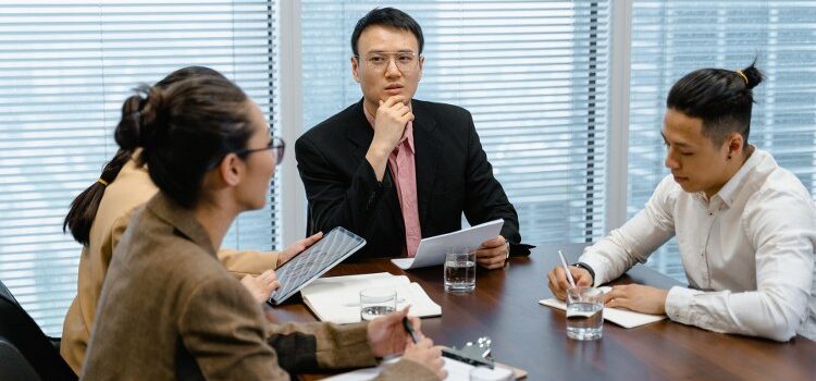 A professional team making a plan in order to overcome barriers to CRM success.