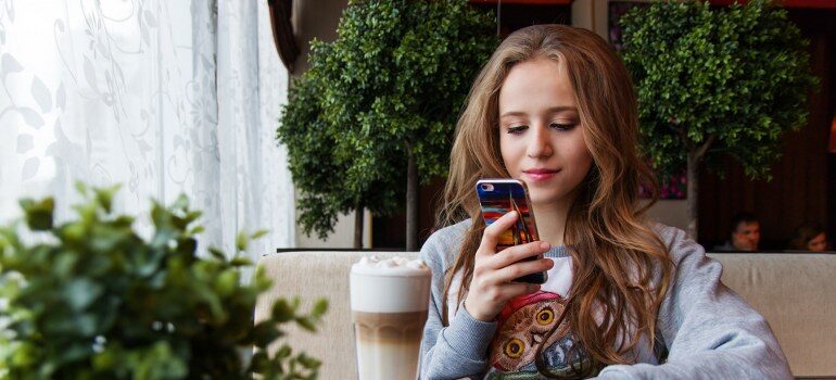 A girl using a phone.
