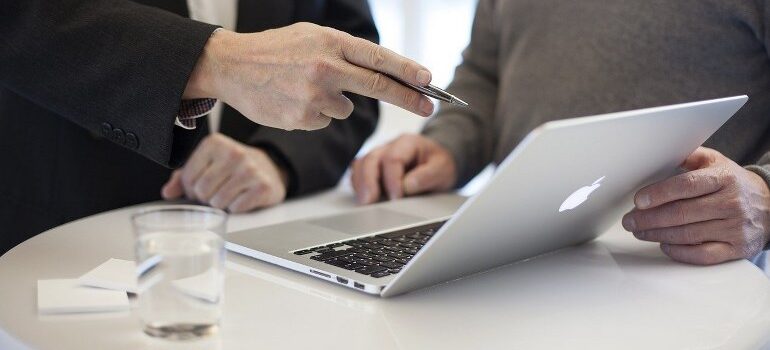A business owner working with a marketing manager.