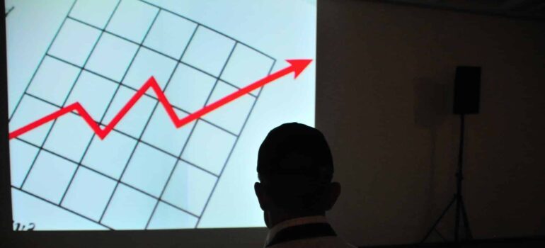 A man looking at a chart.