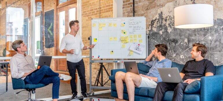 A couple of people in a meeting.