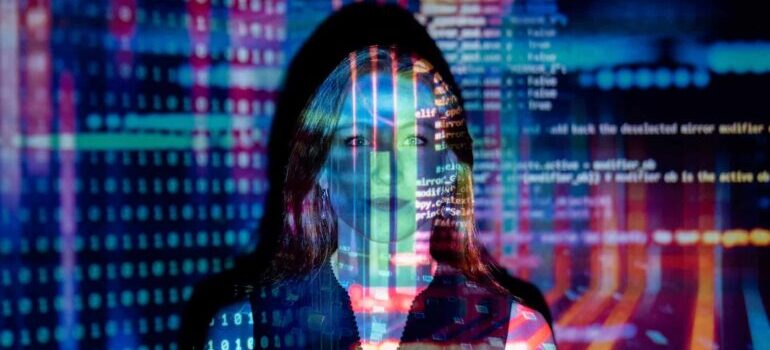 A person standing in blue light.