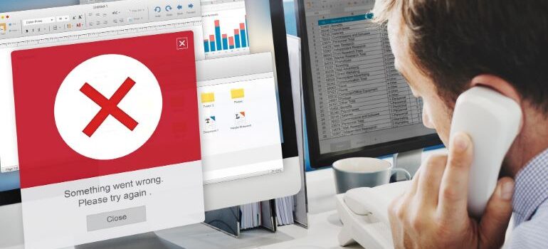 Person looking at an error popup message on screen.
