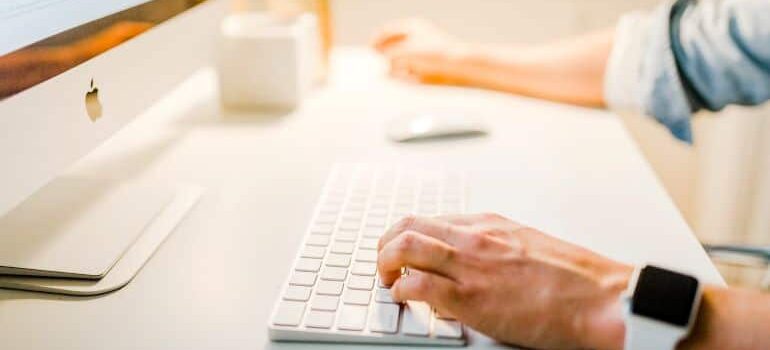 Person typing on keyboard