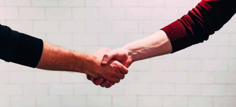 Two people shaking hands.