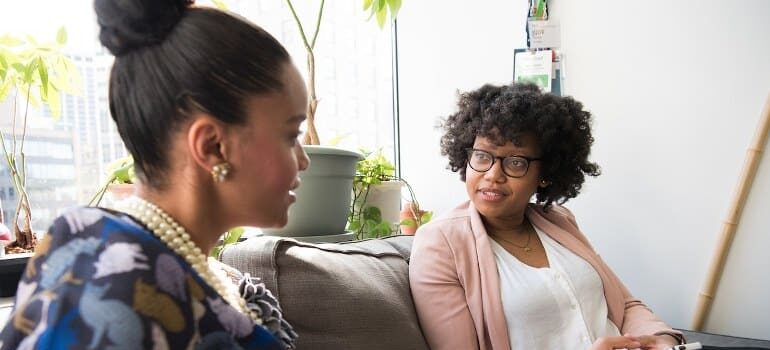 Two African-American women talking.