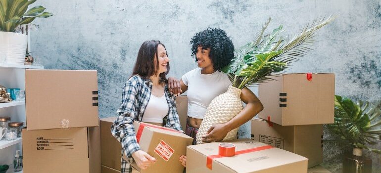 Two women preparing for a relocation.