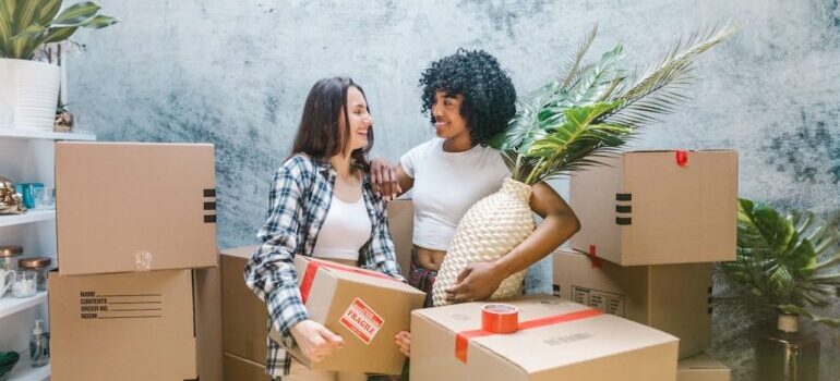 two women about to pack for a move