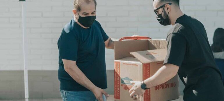 two men loading boxes